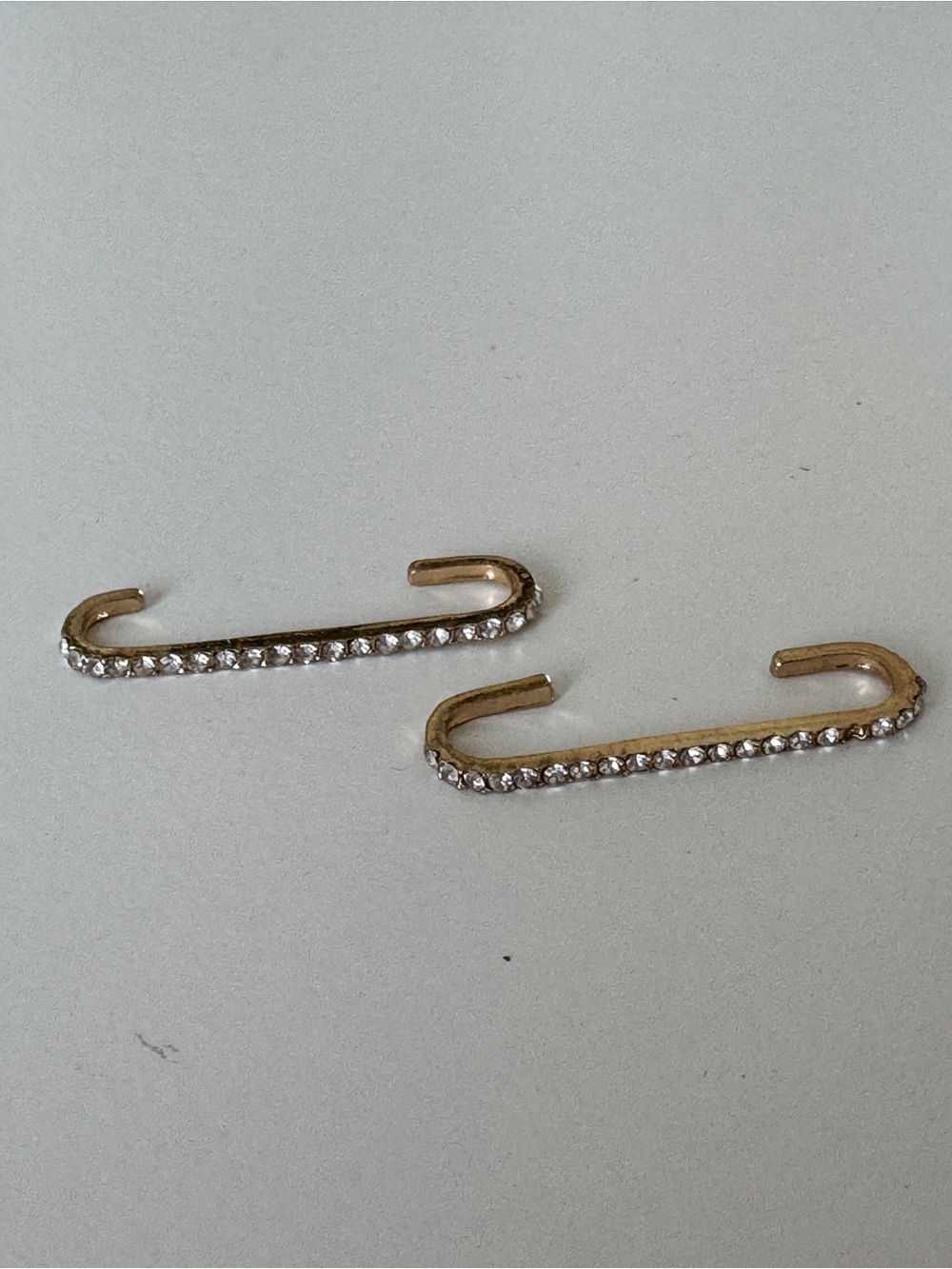 Two ear cuffs